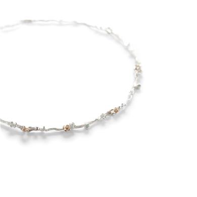 collier en argent avec fleur en or